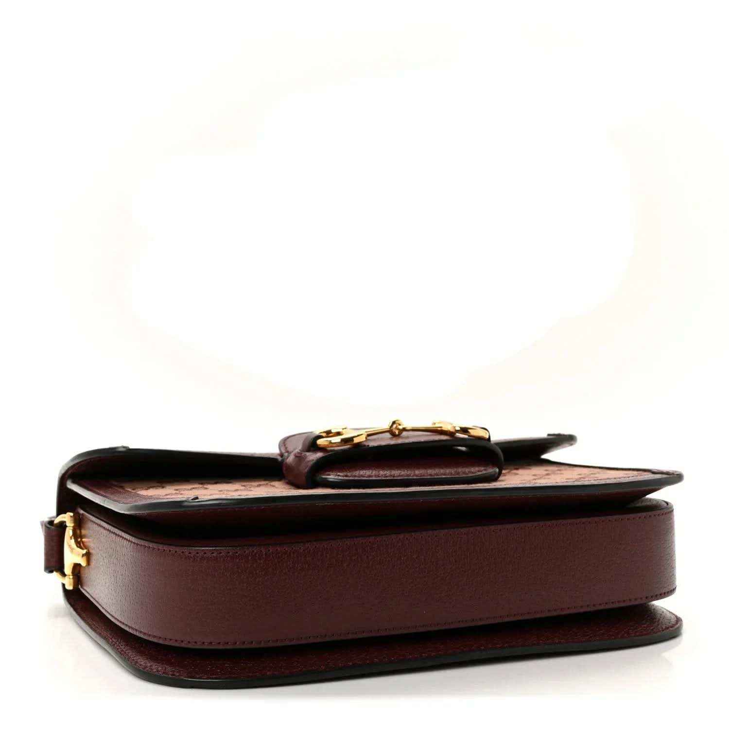 Gucci shoulder bag back view with smooth burgundy leather panel and gold clasp hardware
