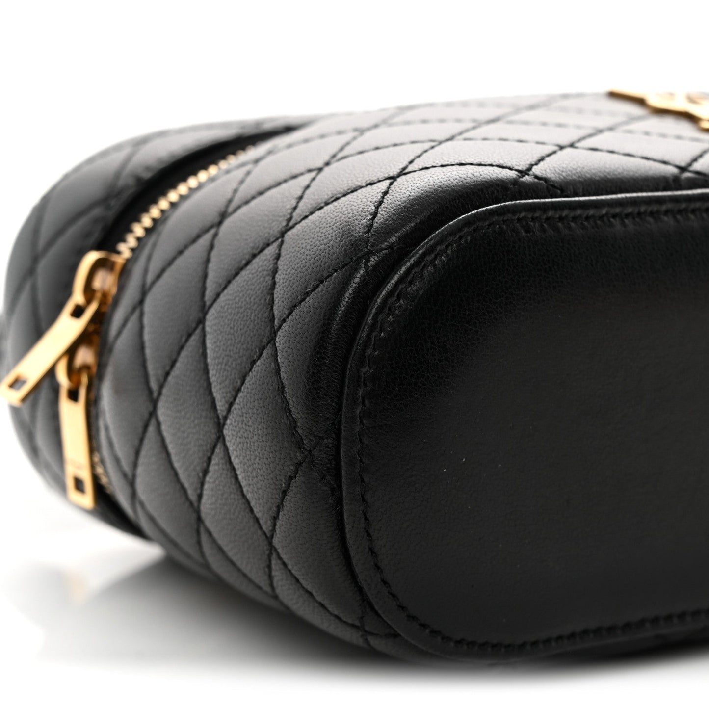 Saint Laurent mini quilted lambskin vanity case close-up of gold zipper and side corner