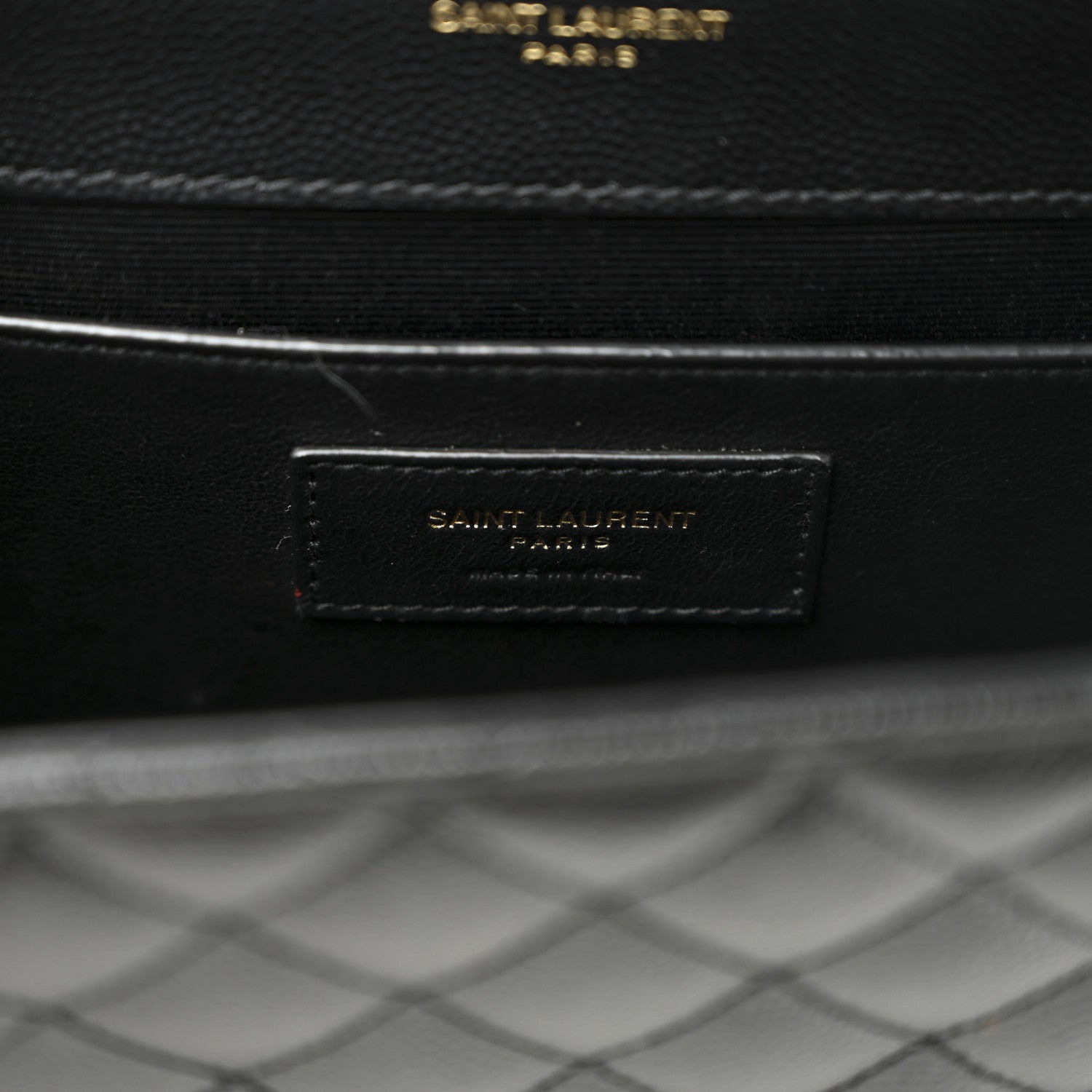 Black leather interior label with “SAINT LAURENT” text