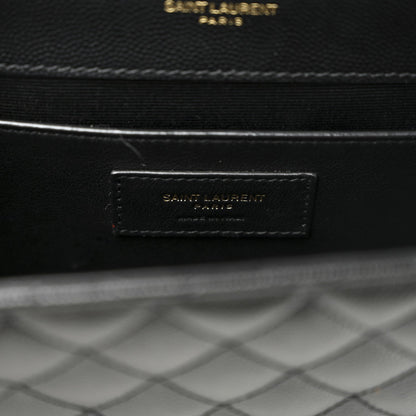 Black leather interior label with “SAINT LAURENT” text