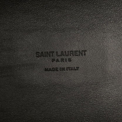 Saint Laurent Paris made in Italy embossing on black leather surface