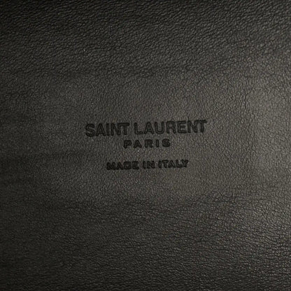Saint Laurent Paris made in Italy embossing on black leather surface