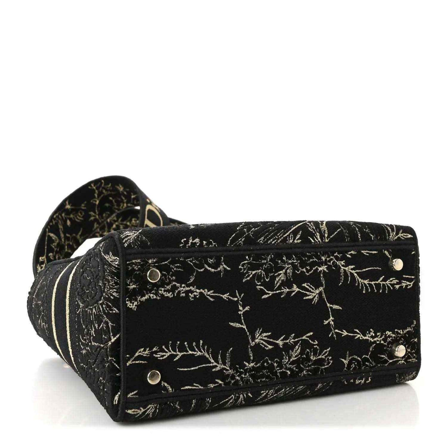 Black embroidered handbag with gold floral pattern, front snap closure and side studs