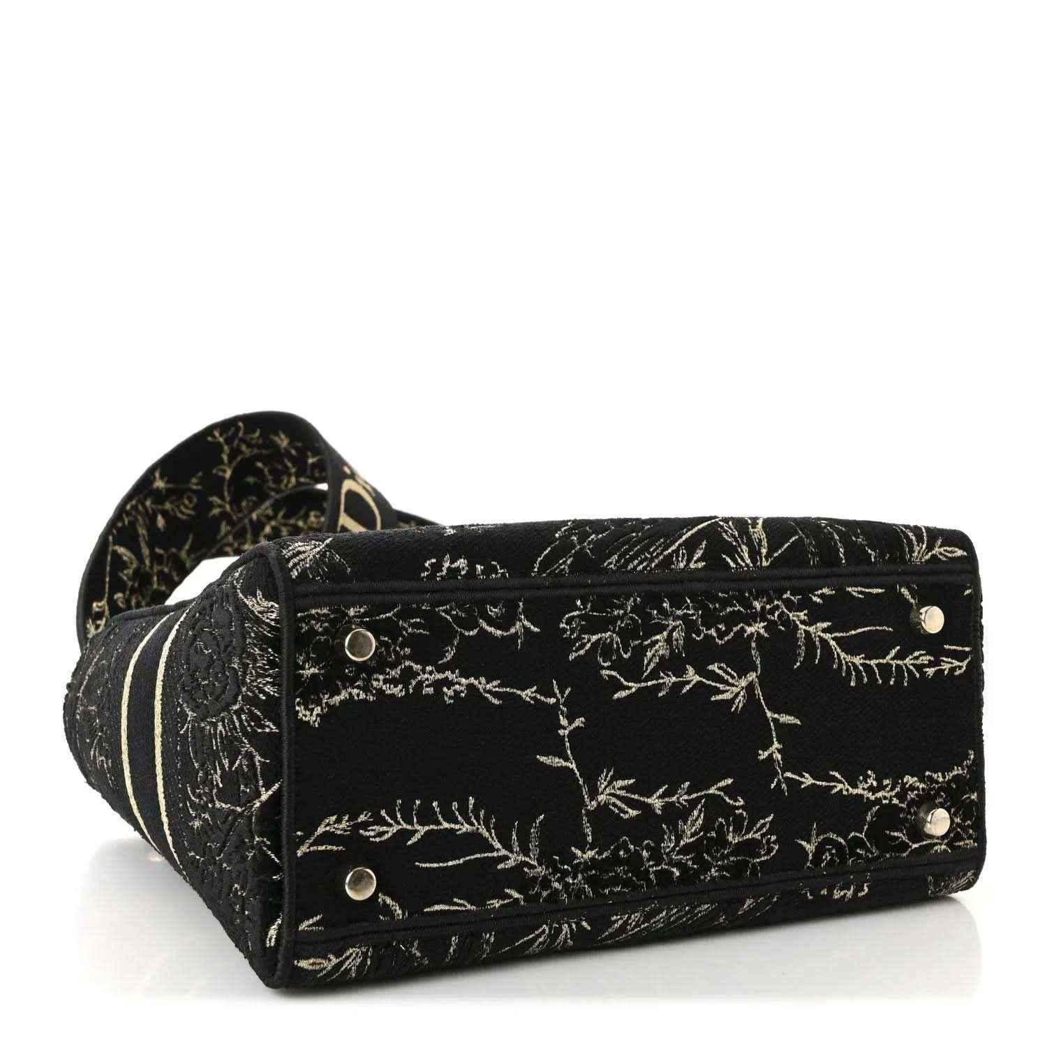Black embroidered handbag with gold floral pattern, front snap closure and side studs