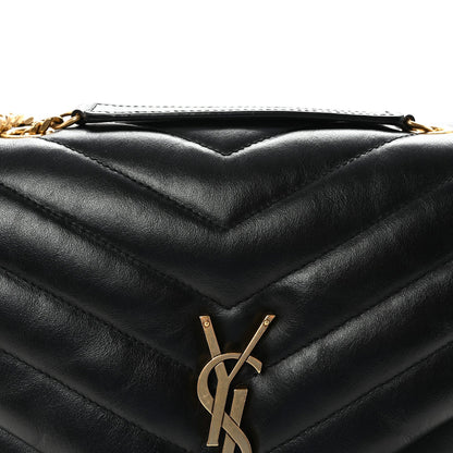 Black quilted satchel with YSL monogram and gold hardware at front.