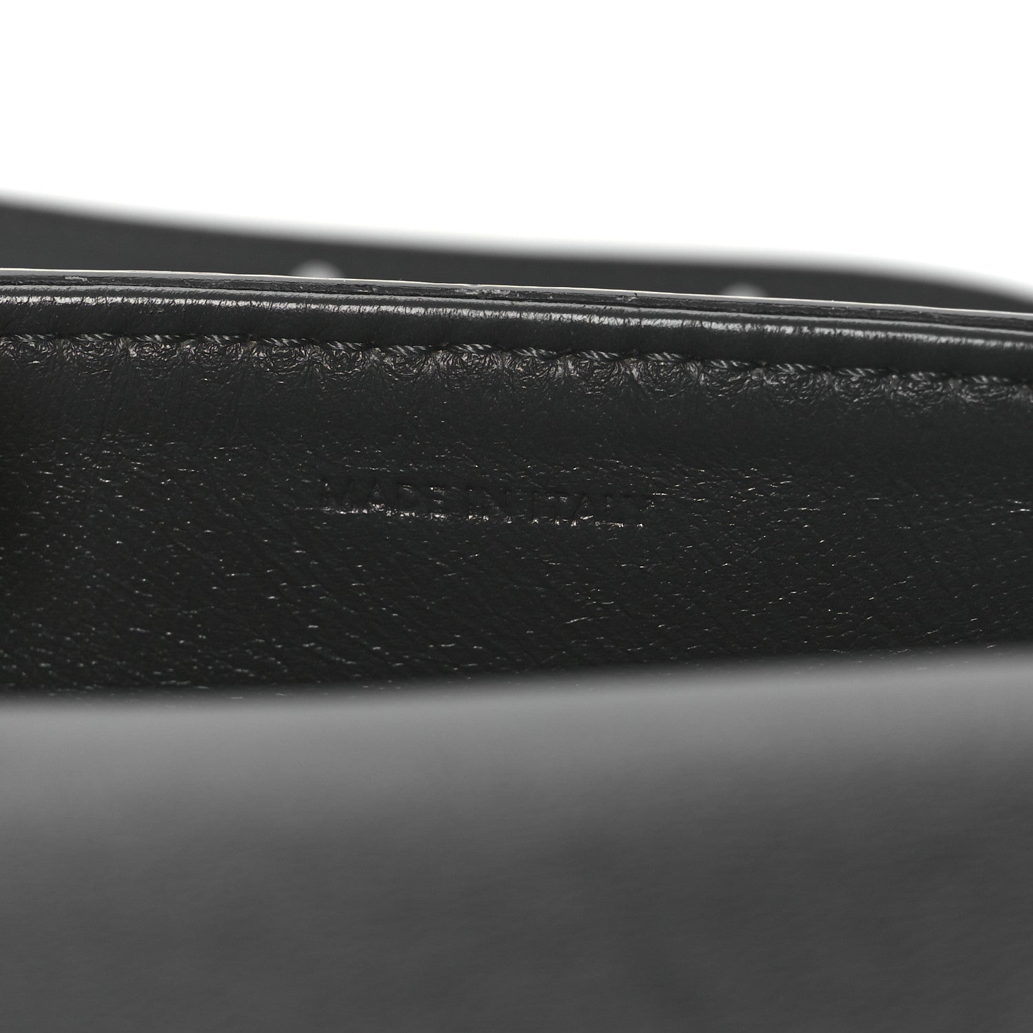 Close-up of black leather strap and grey snakeskin edge stitching