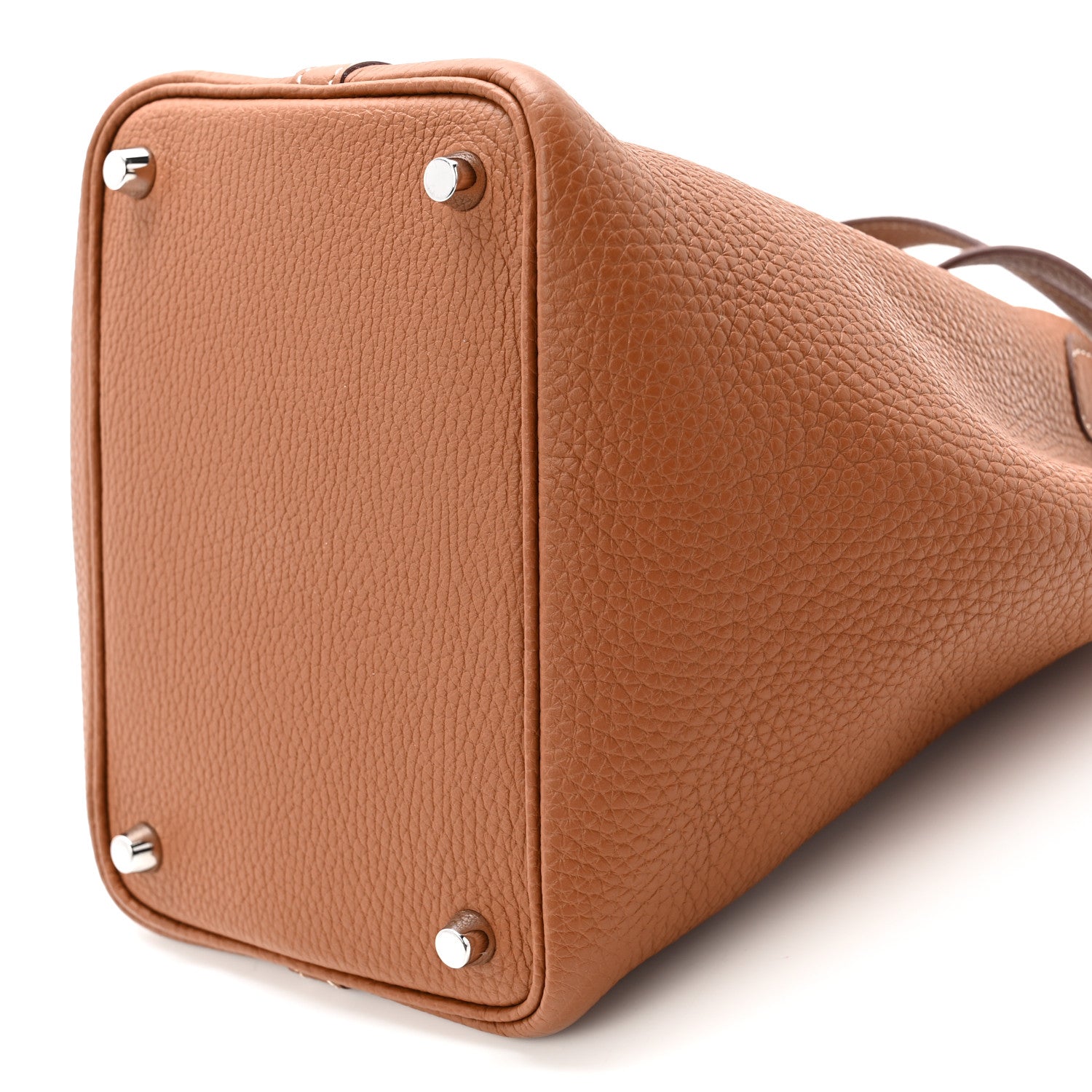 Cognac brown leather tote bag with squared sides, studs, and short top handles