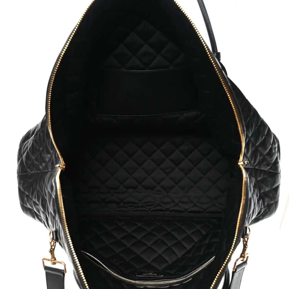 Black quilted leather interior with zippered opening and gold-tone zipper pulls