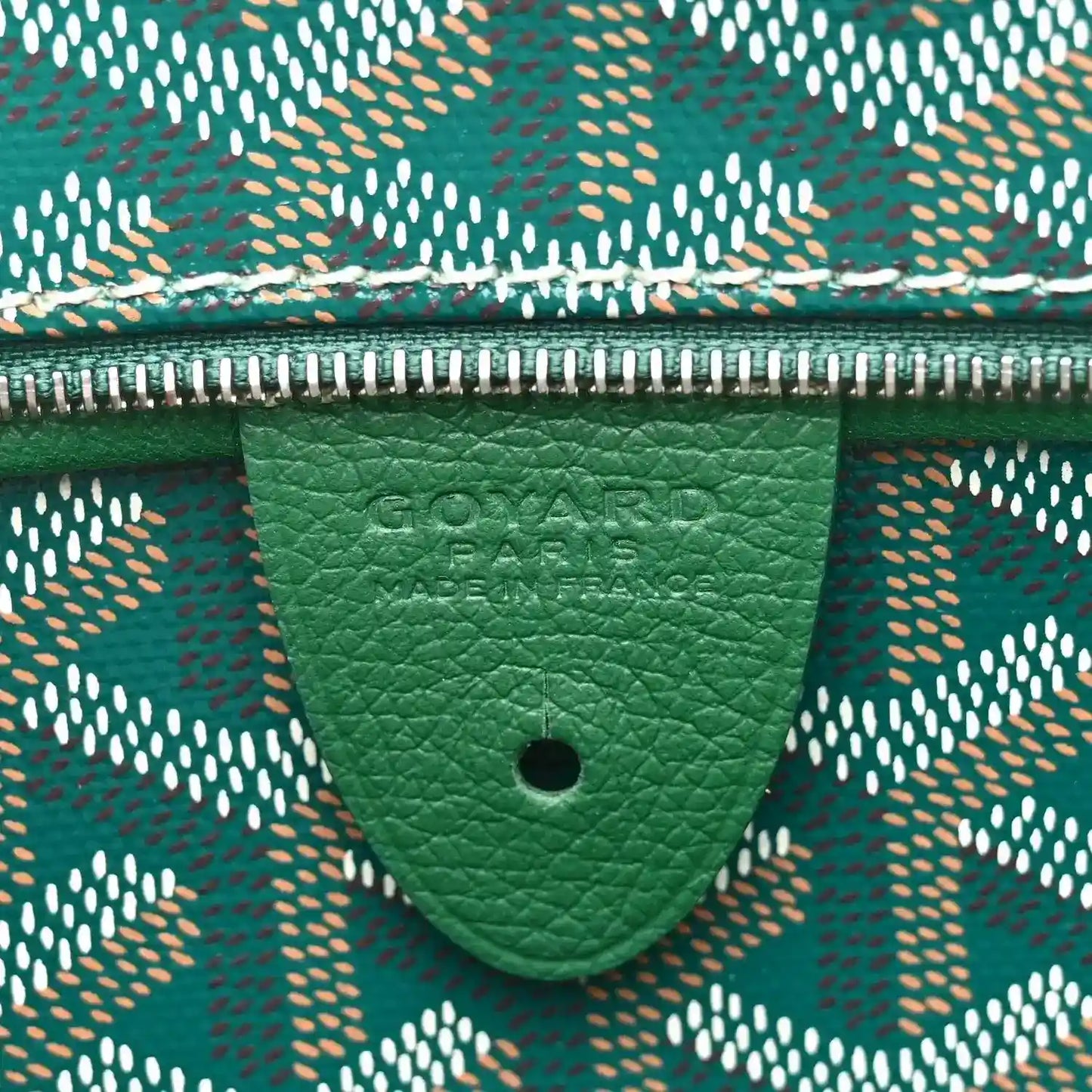 Goyard Artois PM tote bag label on green leather trim with scalloped pocket