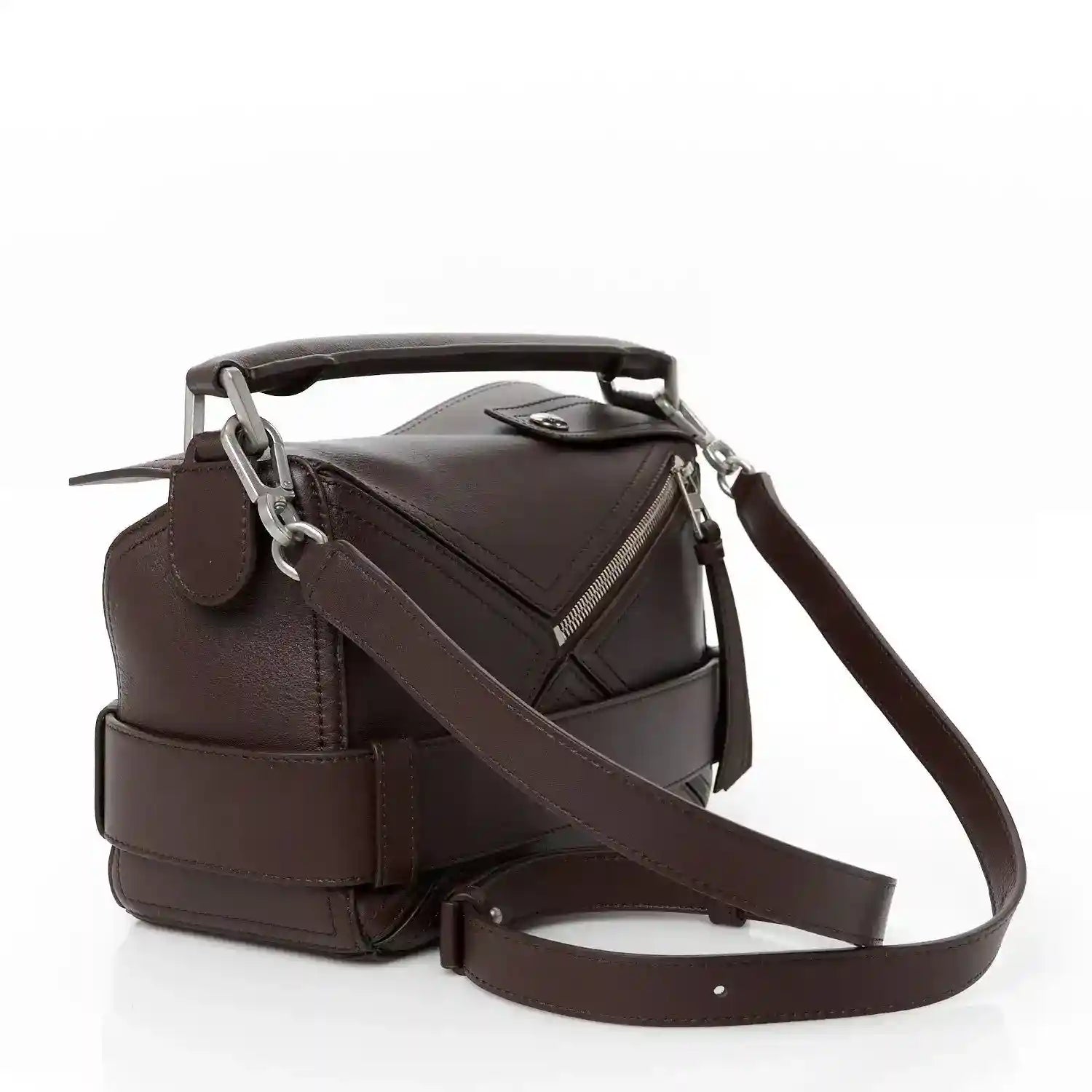 Small leather biker bag with front flap, top handle, and crossbody strap in dark brown