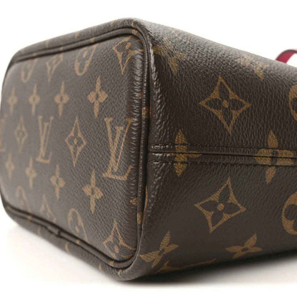 Louis Vuitton monogram canvas pouch with brown leather trim, close-up seam