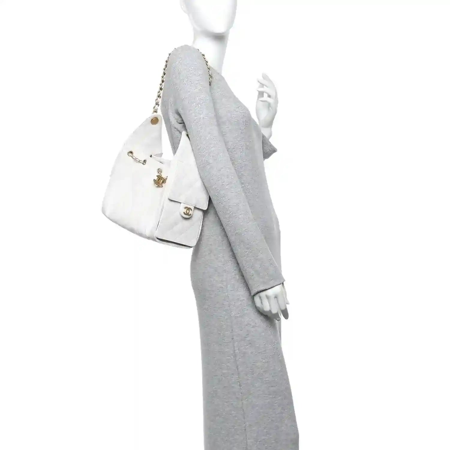 White quilted caviar leather handbag with chain strap, shown from the side