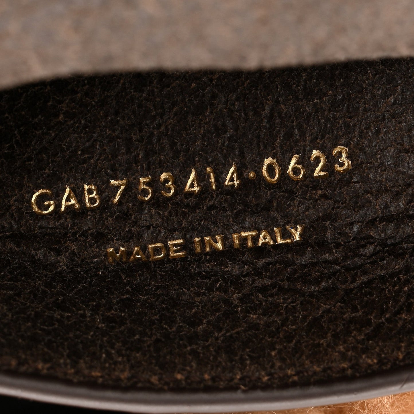 Saint Laurent satchel underside with serial code and 'Made in Italy' stamp