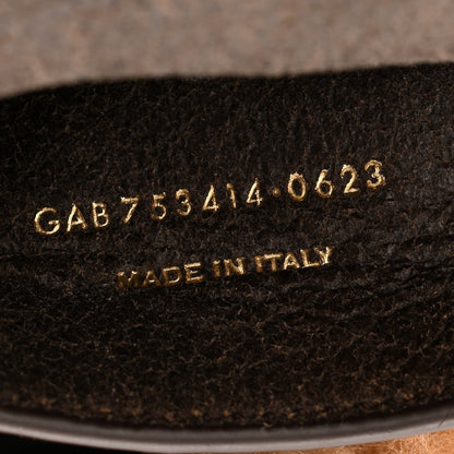 Saint Laurent satchel underside with serial code and 'Made in Italy' stamp