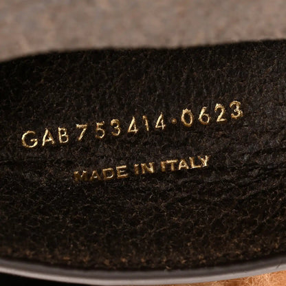 Saint Laurent satchel underside with serial code and 'Made in Italy' stamp