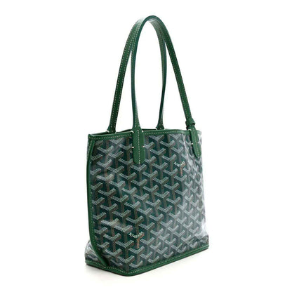 Green reversible mini tote bag with patterned exterior and top handles
