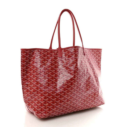 Red Goyardine canvas tote bag with Goyard pattern and top handles.