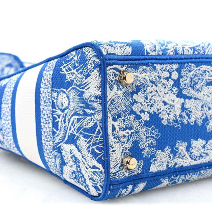 Christian Dior medium tote bag end panel in blue and white toile print with gold snap buttons