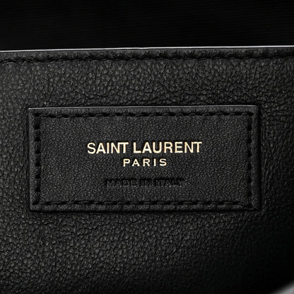 Black leather brand patch reading SAINT LAURENT PARIS, made in Italy