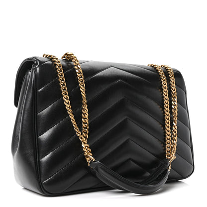 Black chevron quilted shoulder bag with gold chain strap and YSL emblem