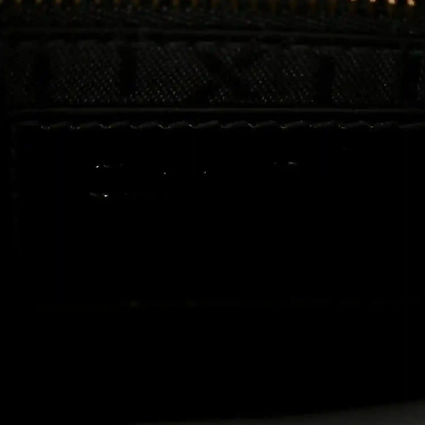 Black interior lining view of a mini handbag