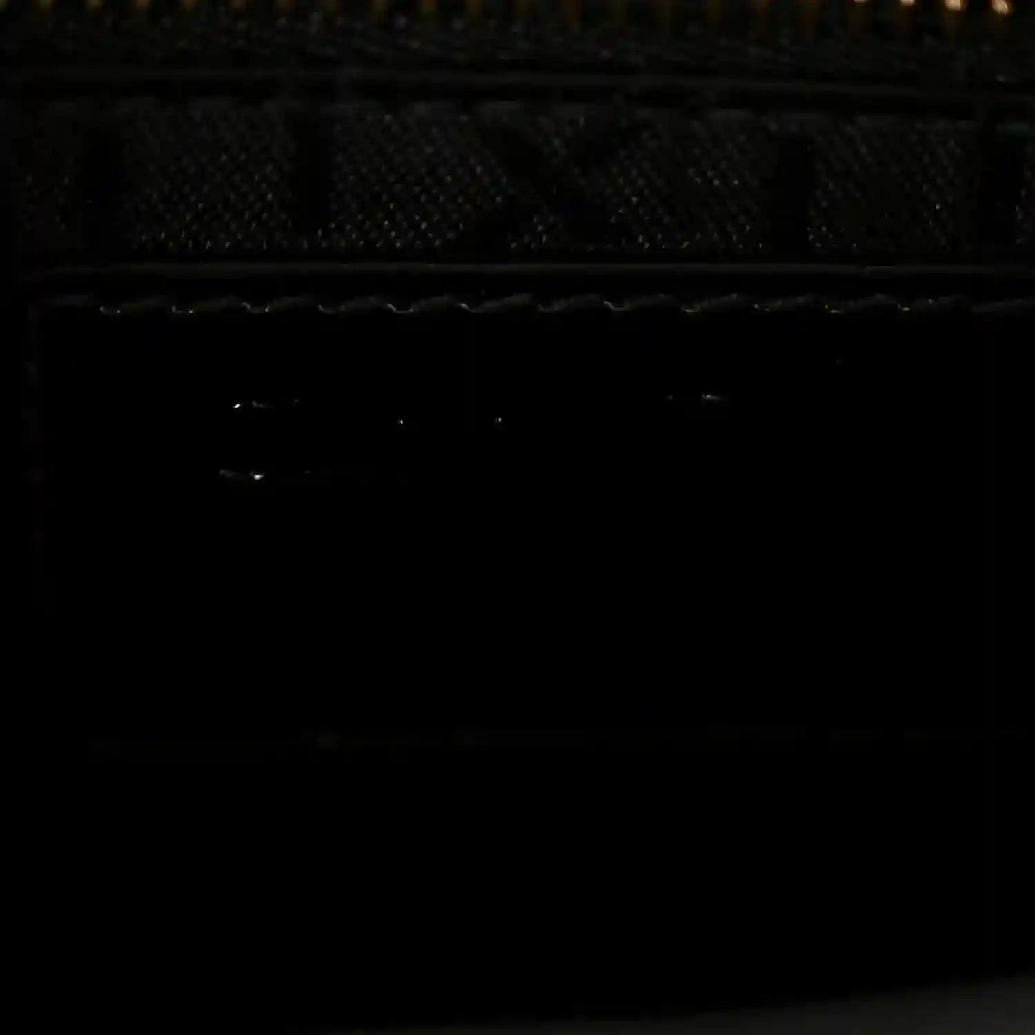 Black interior lining view of a mini handbag