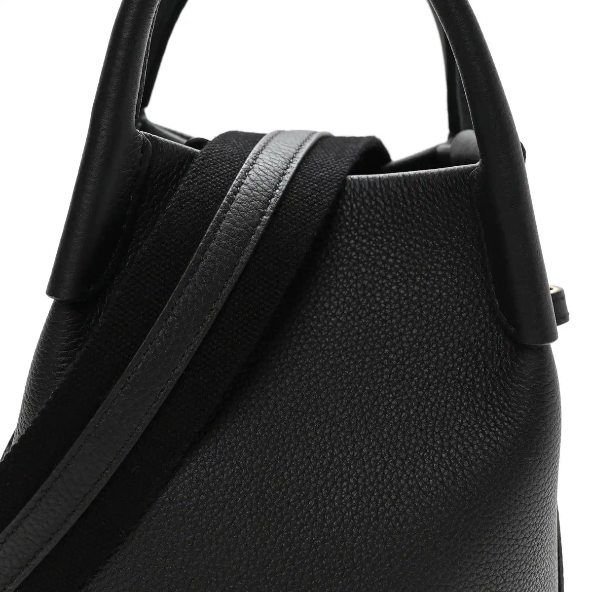Black grained calfskin micro bale bag with top handle and strap detail