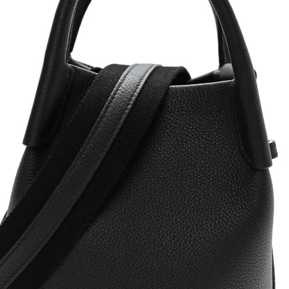 Black grained calfskin micro bale bag with top handle and strap detail
