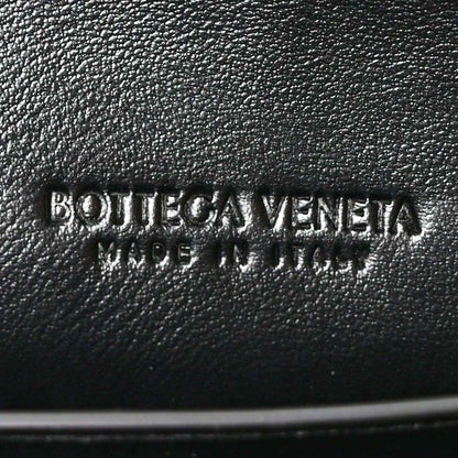 Bottega Veneta logo stamp on black leather clutch