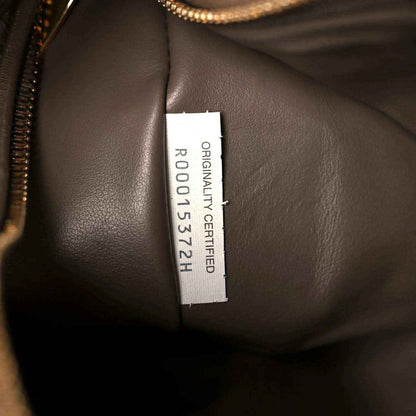 Taupe leather bag interior with “ORIGINAL CERTIFIED” size label