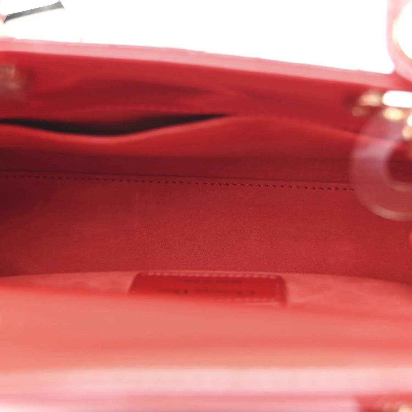 Christian Dior small red patent quilted handbag, close-up of interior and zipper area