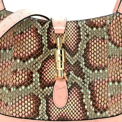 Gucci small hobo bag front clasp with gold-tone hardware and snakeskin panel