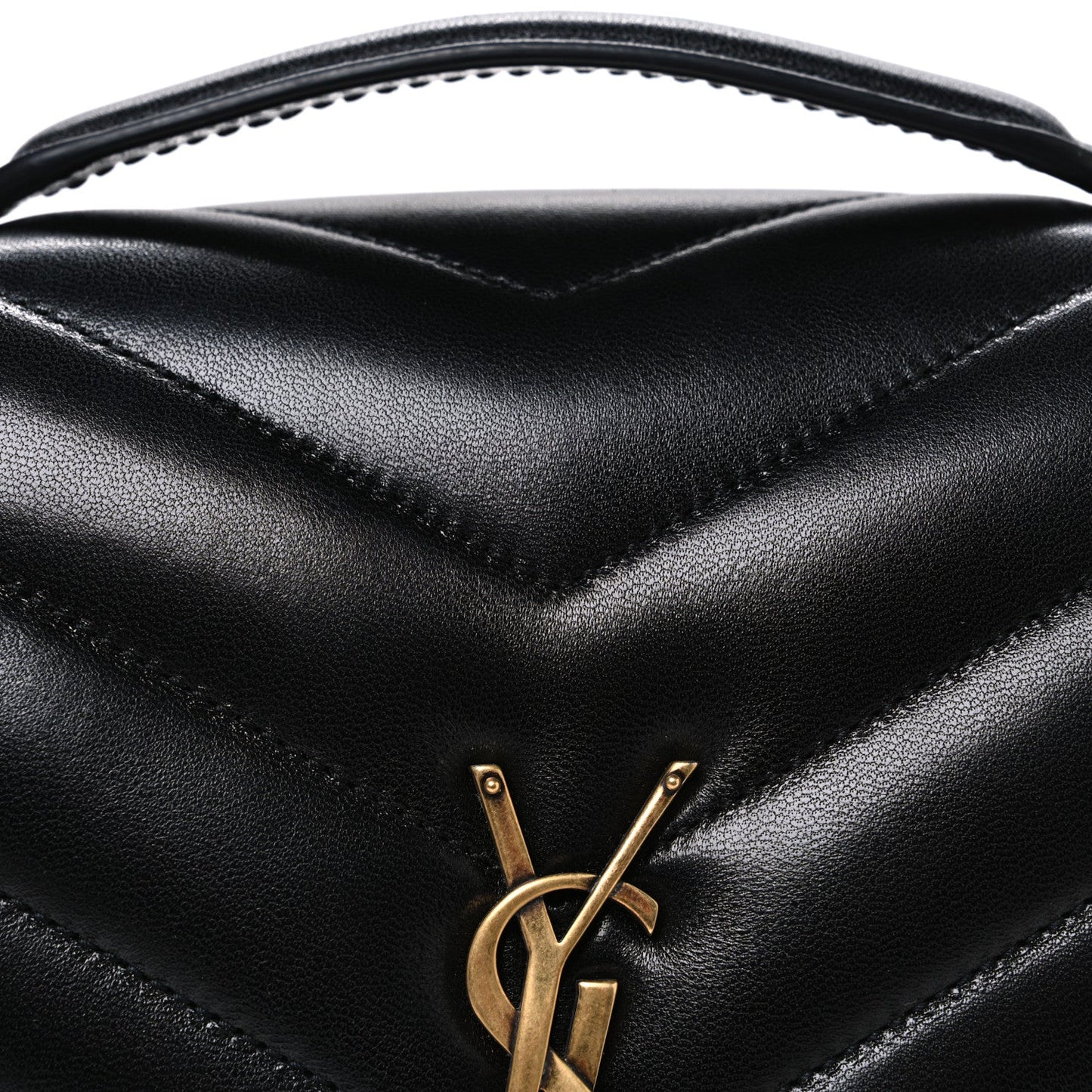 Black chevron quilted flap with gold YSL monogram clasp, close-up