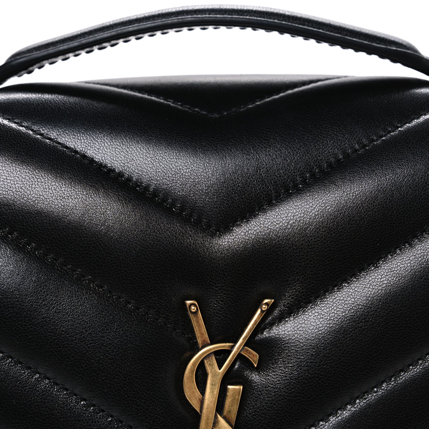 Black chevron quilted flap with gold YSL monogram clasp, close-up