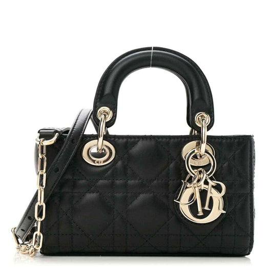 Black lambskin handbag with quilted cannage pattern, top handles, and gold chain charm