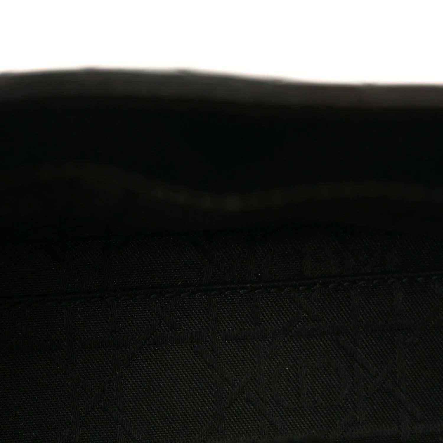 Black textured interior lining of a mini handbag
