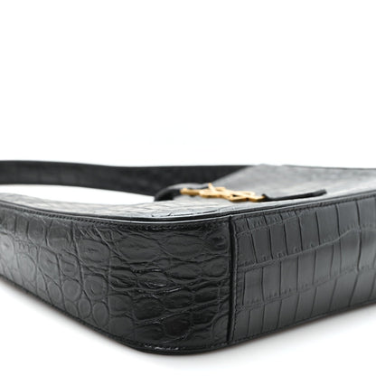 Black embossed calfskin hobo bag close-up of side panel and top edge