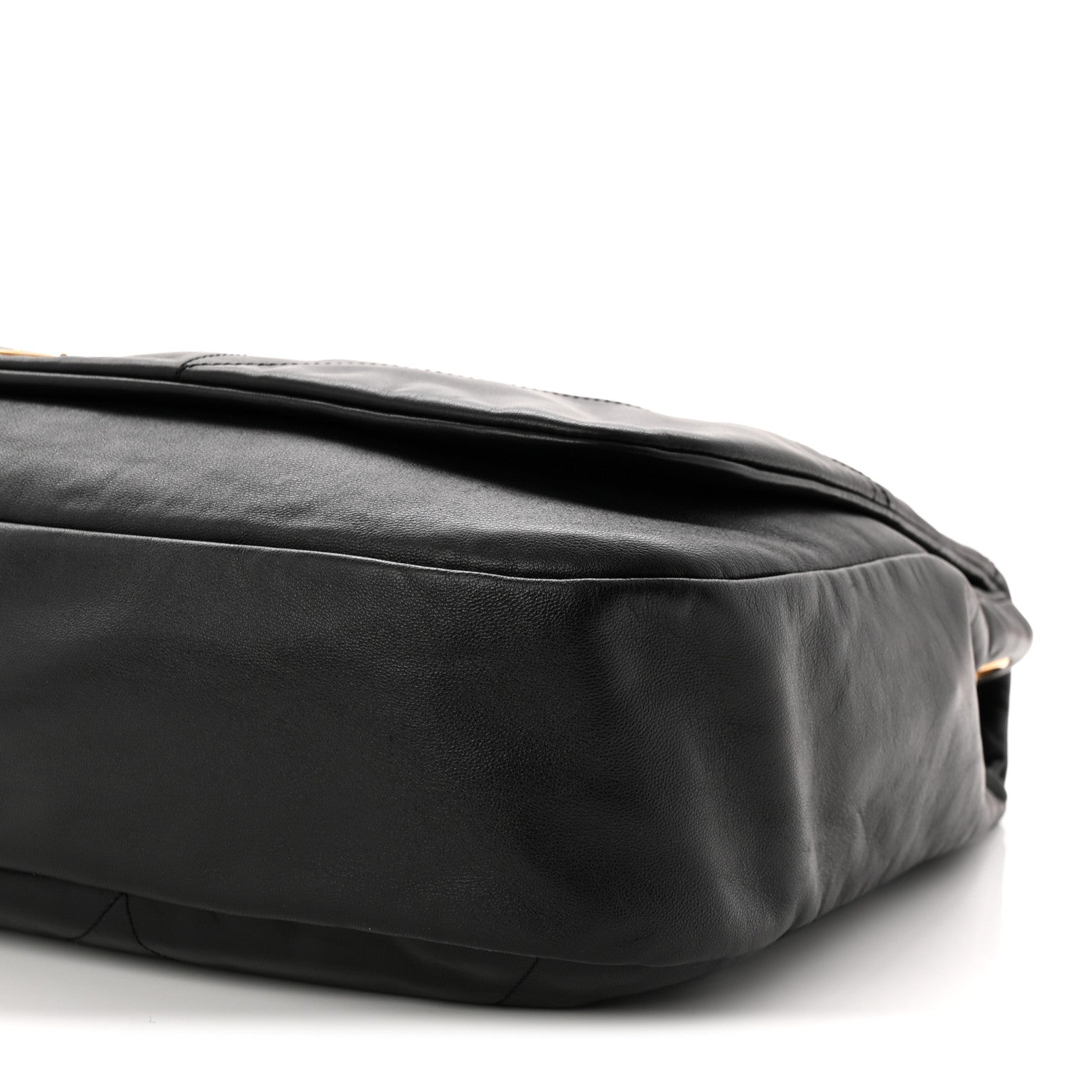 Black quilted lambskin shoulder bag close-up of side seam and bottom corner