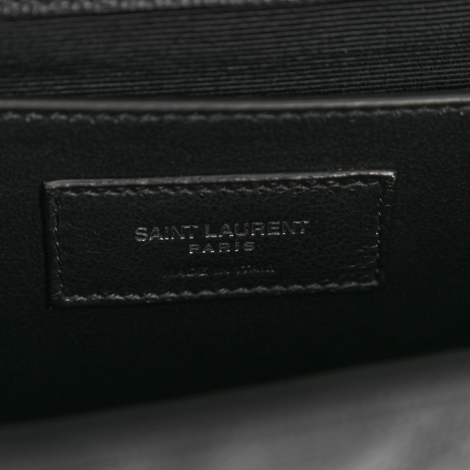 Black leather satchel interior with Saint Laurent Paris stamped patch
