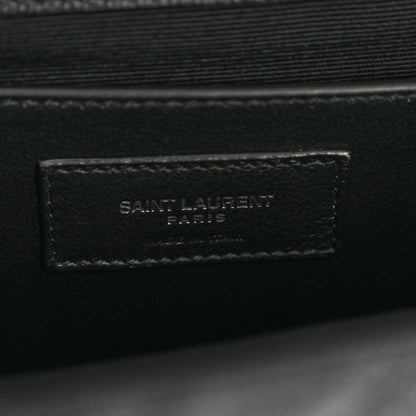 Black leather satchel interior with Saint Laurent Paris stamped patch
