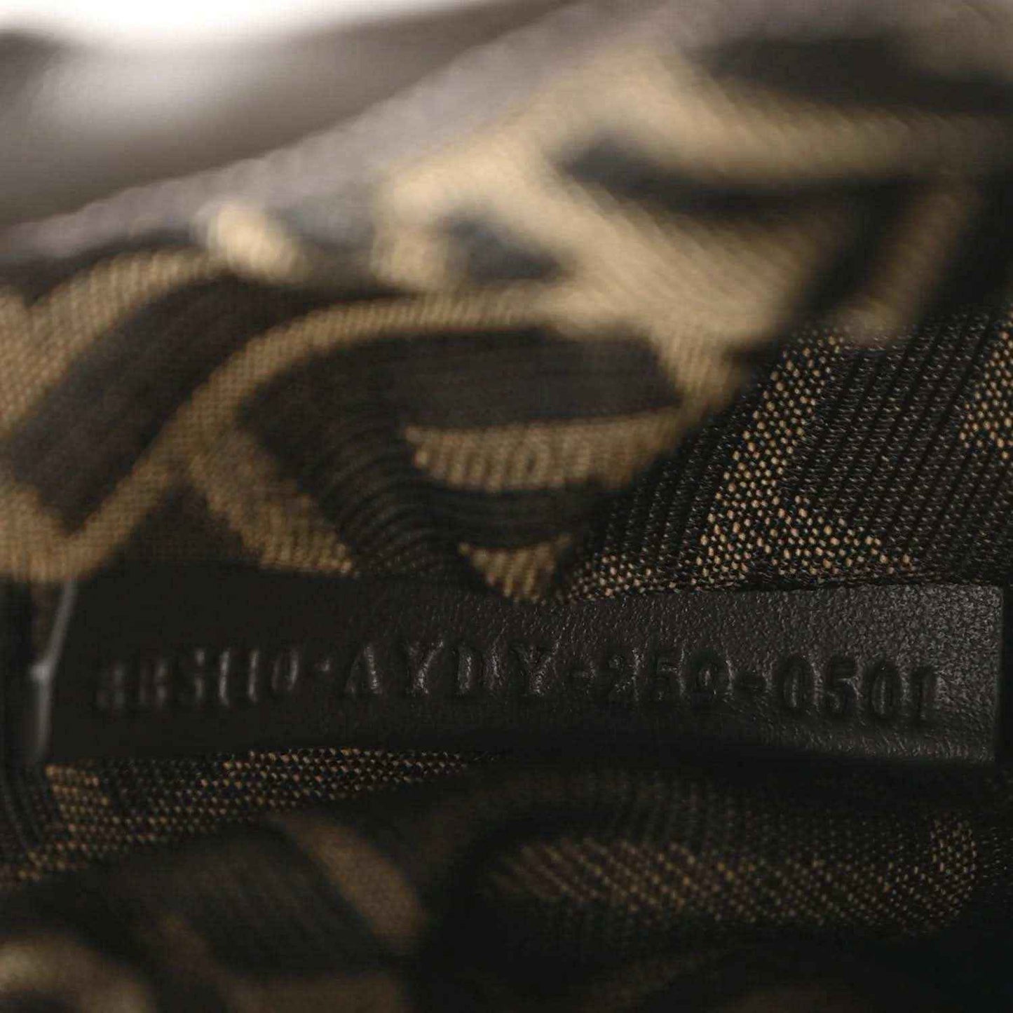 Close-up of internal jacquard lining with stylized FF logo detail.