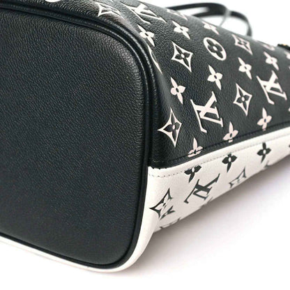 Neverfull MM pouch corner with black leather trim and black-and-white monogram canvas