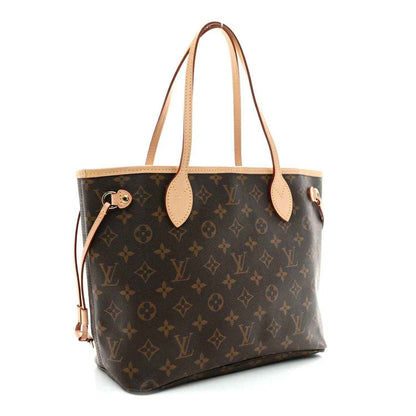 Monogram canvas tote bag front view with tan leather handles, top zipper hardware and studs