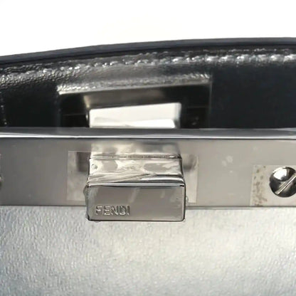 FENDI engraved metal plaque on satchel interior flap with dark leather backing