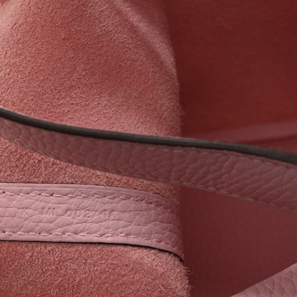 Mauve textured leather handbag strap seam detail with metal edge trim