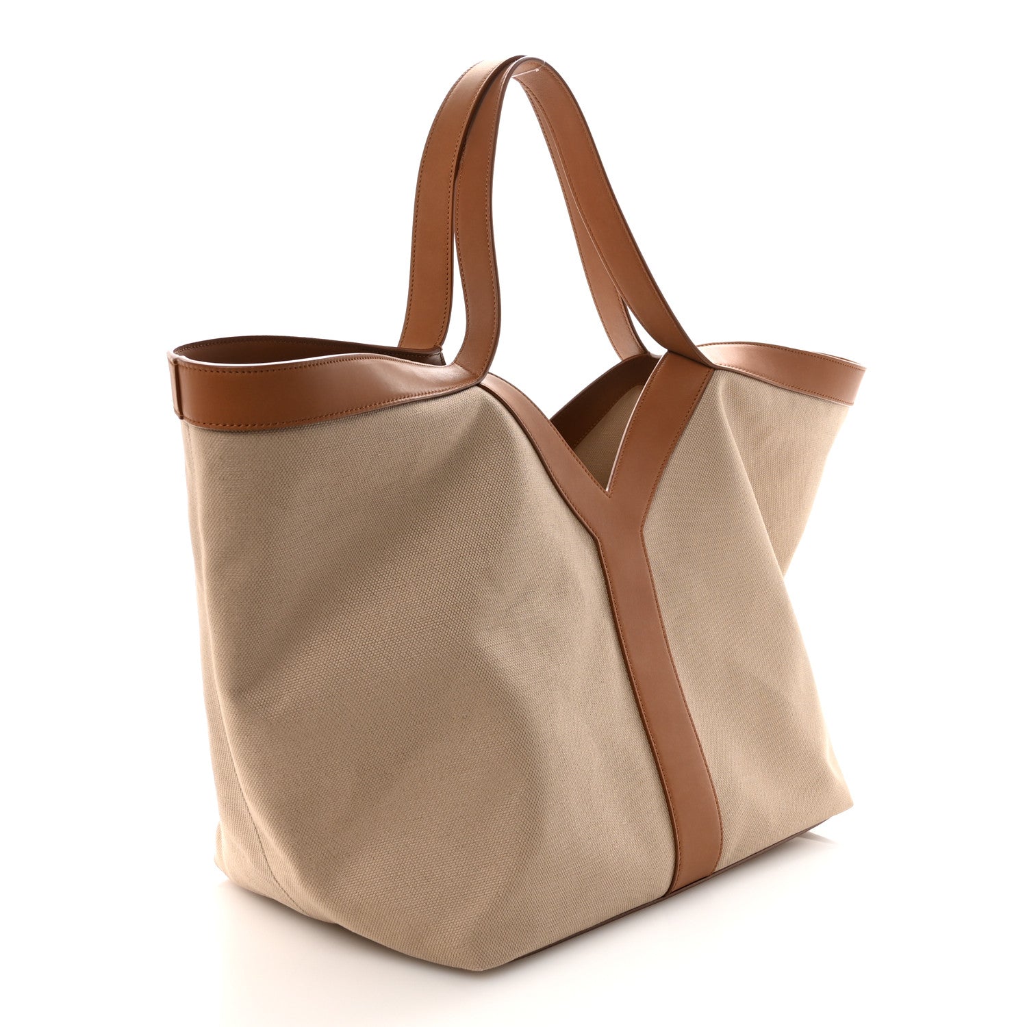 Tan canvas Y tote with brown side panel and top handles, angled view