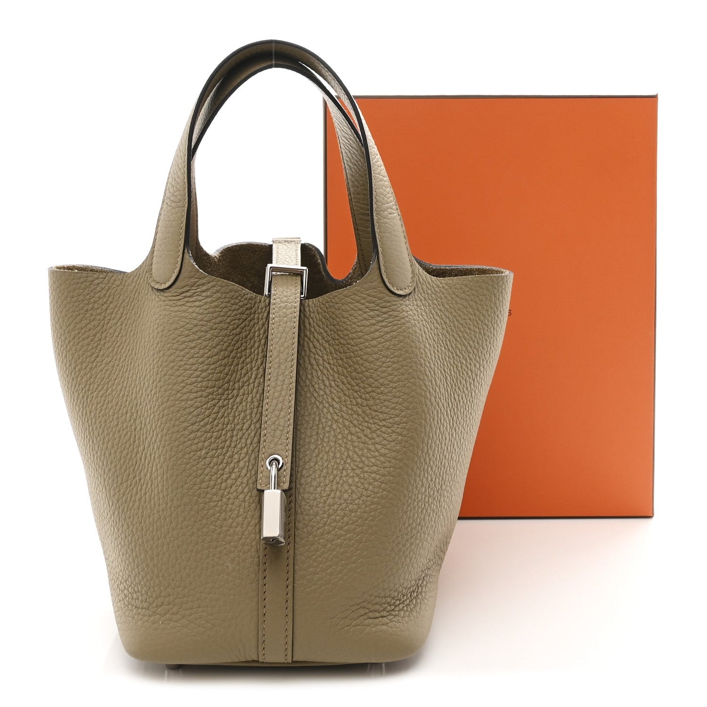 Beige leather tote handbag with top handles and central lock detail