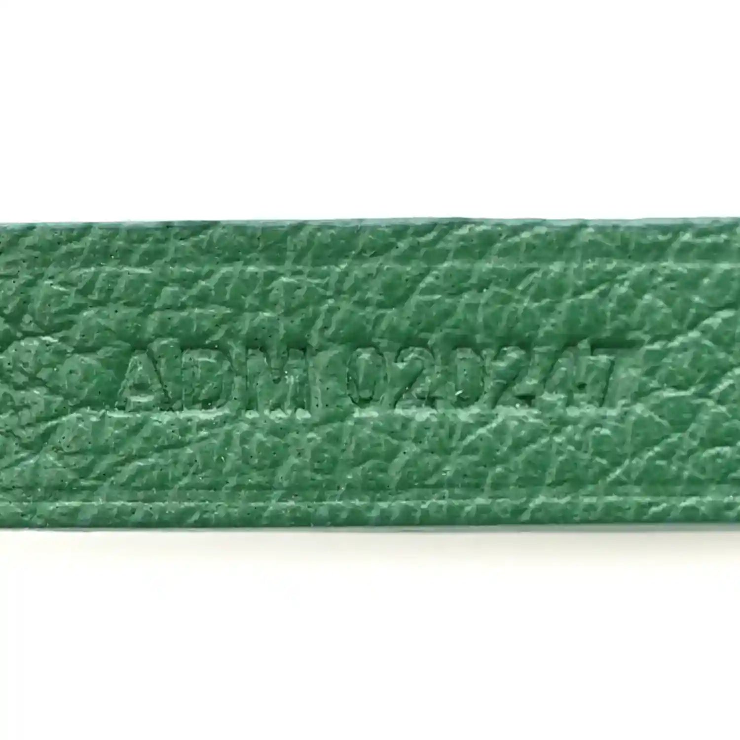 Green coated canvas label with embossed text
