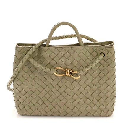 Woven nappa leather tote with top handles and braided crossbody strap, light tan