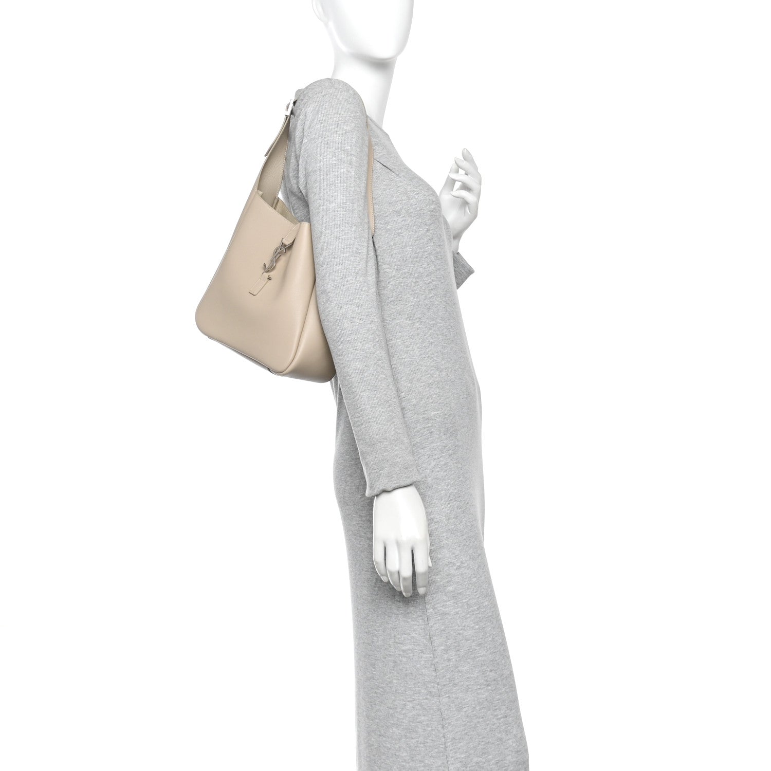 Small hobo bag in sea-salt beige, worn at shoulder, slim profile